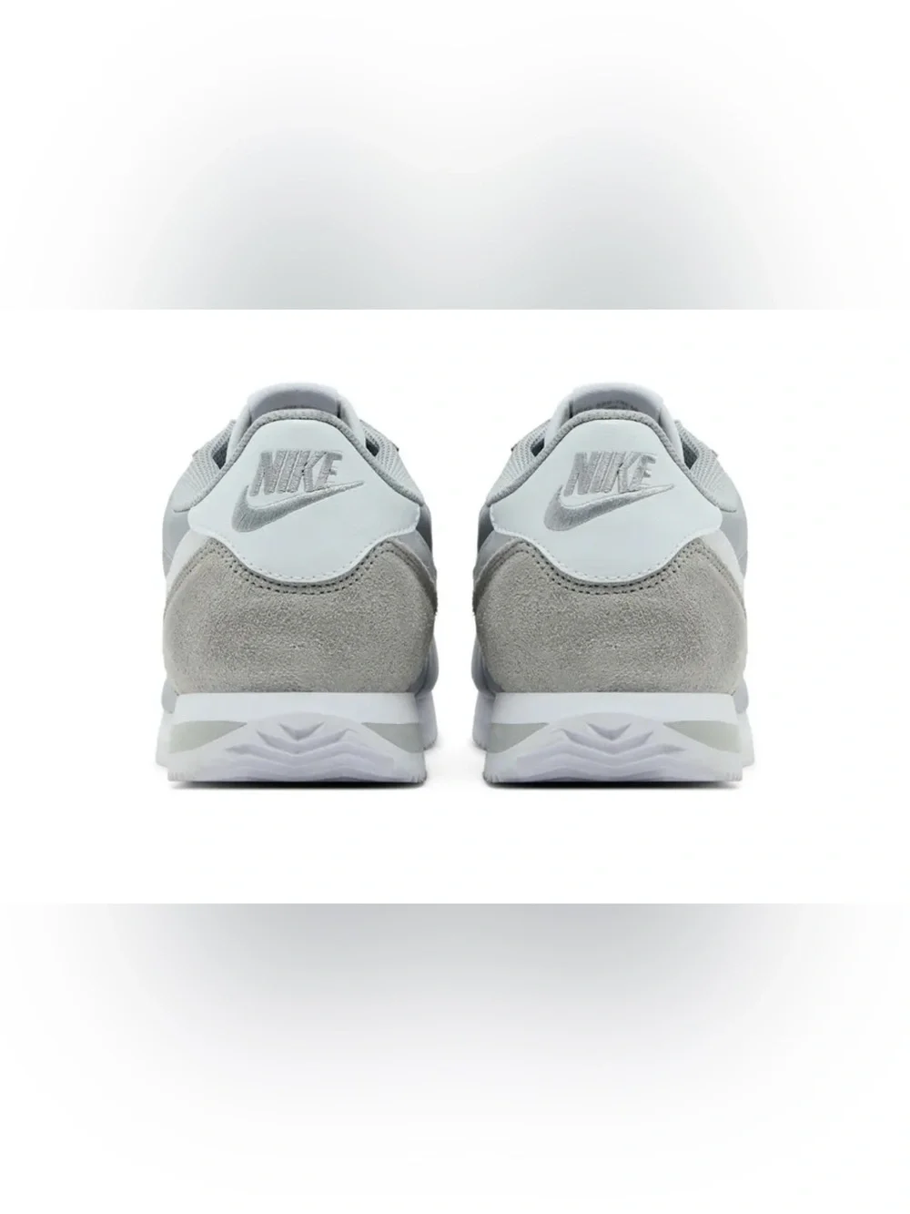 Woman’s gray Nike Cortez basic nylon